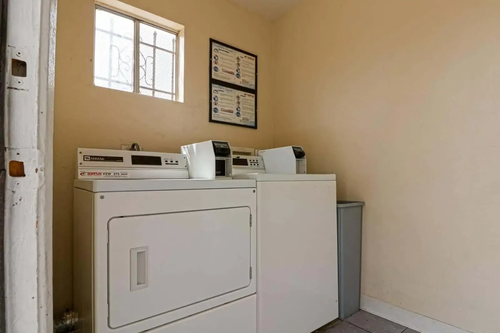 Shared laundry room with washers and dryers